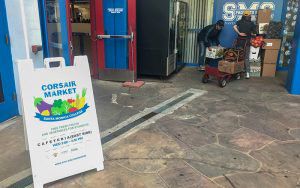 Students at Caifornia’s Santa Monica College help set up the school’s weekly Corsair Market